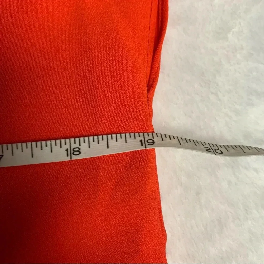 Rachel Zoe bright orange blouse size Small bold seam down the front